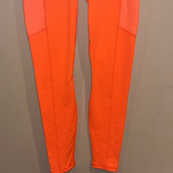 Fabletics Powerhold bright neon orange leggings size XS with mesh side pockets - Picture 3 of 10